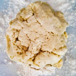 dough on a table with flour