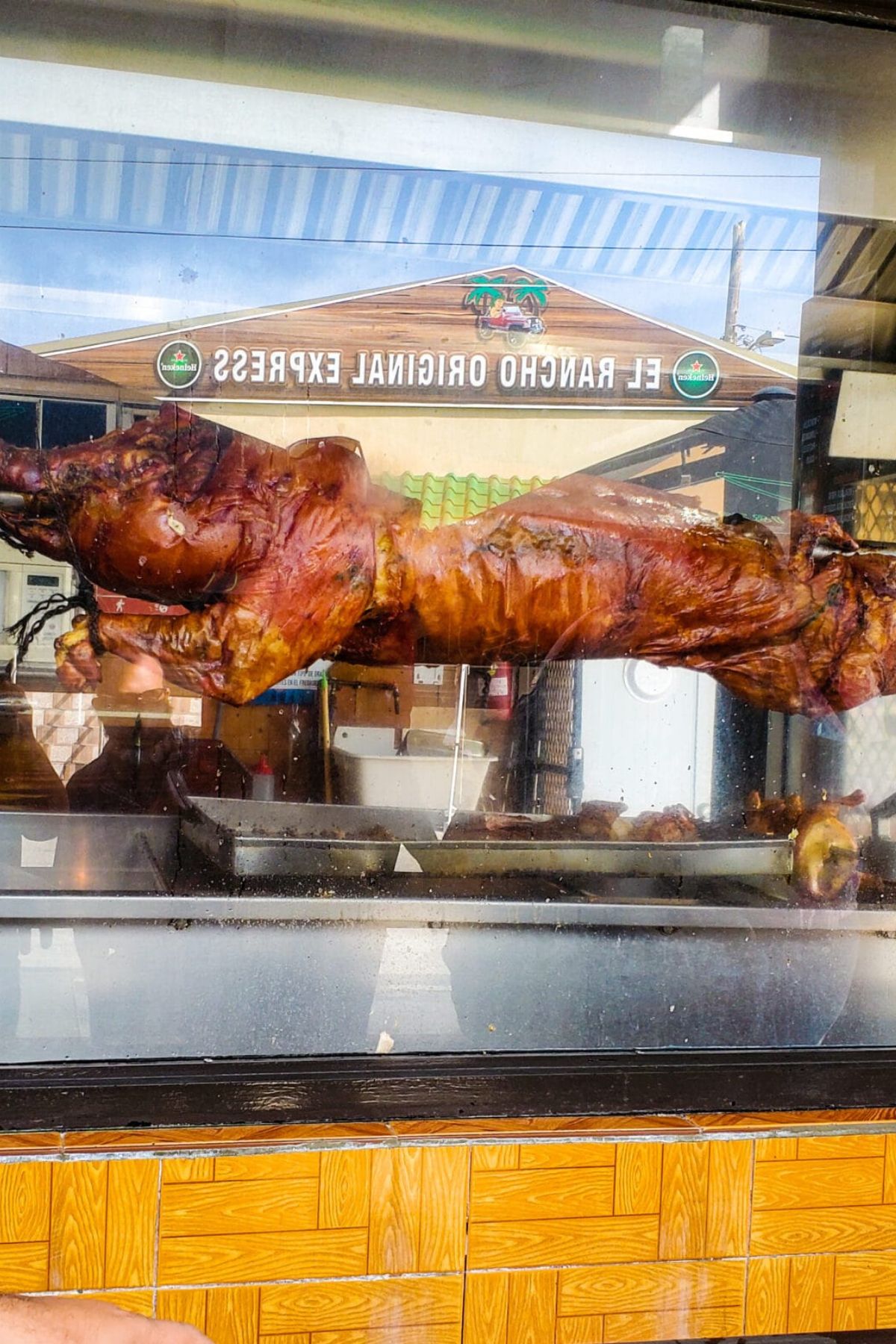 A roasted pig  at the window of a popular restaurant in Guavate, Puerto Rico.