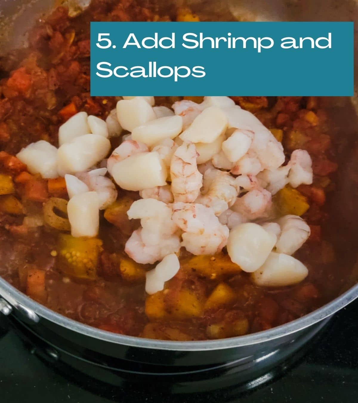 adding raw shrimp and scallops