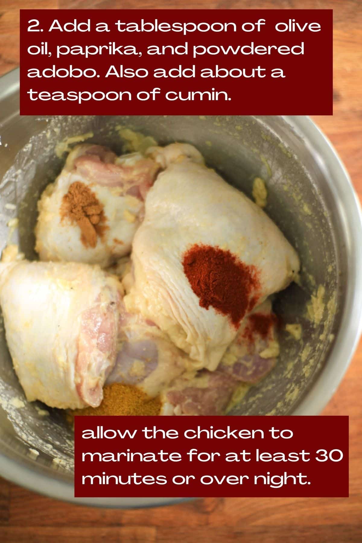 Image of a mixing bowl with chicken thighs and seasoning.