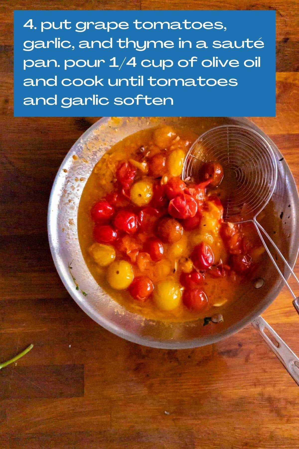 a saute pan with cooked grape tomatoes and oil.