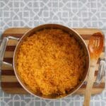 Large pot with cooked yellow rice.