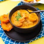 Caldo santo served in a bowl with tostones.
