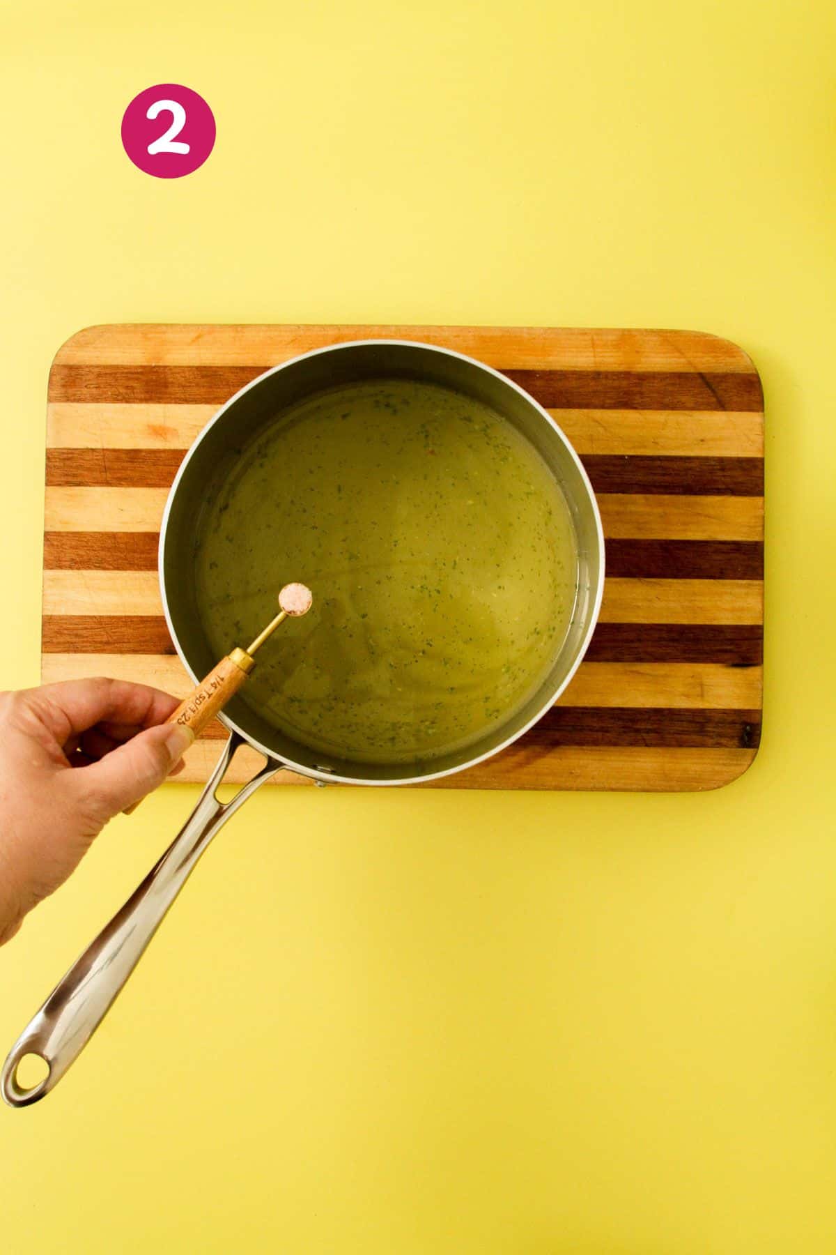 Small pot with broth, sofrito and a quarter teaspoon of salt.