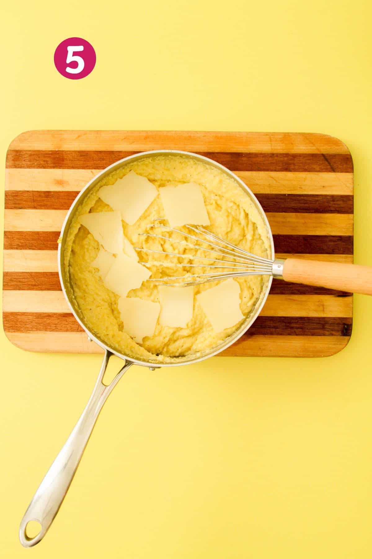 Pot with funche and chopped sliced Swiss cheese on top of it for melting and incorporating.
