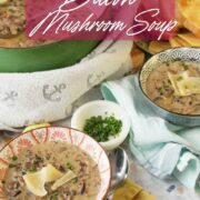 Styled overhead scene of bacon mushroom soup in a green Dutch oven with ladle, bowls of soup, bread slices, and chopped herbs, with text overlay reading “New recipe on the blog” and “Rich and Thick Bacon Mushroom Soup.”