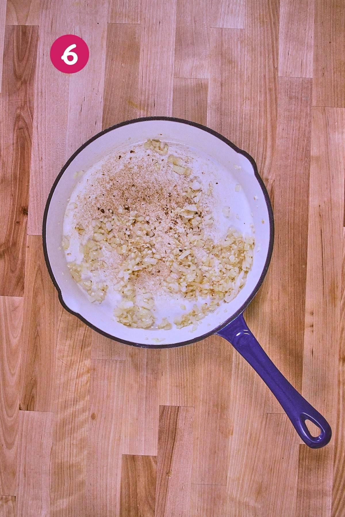 Overhead view of sliced shallots sautéing with black pepper in skillet, labeled with step 6.