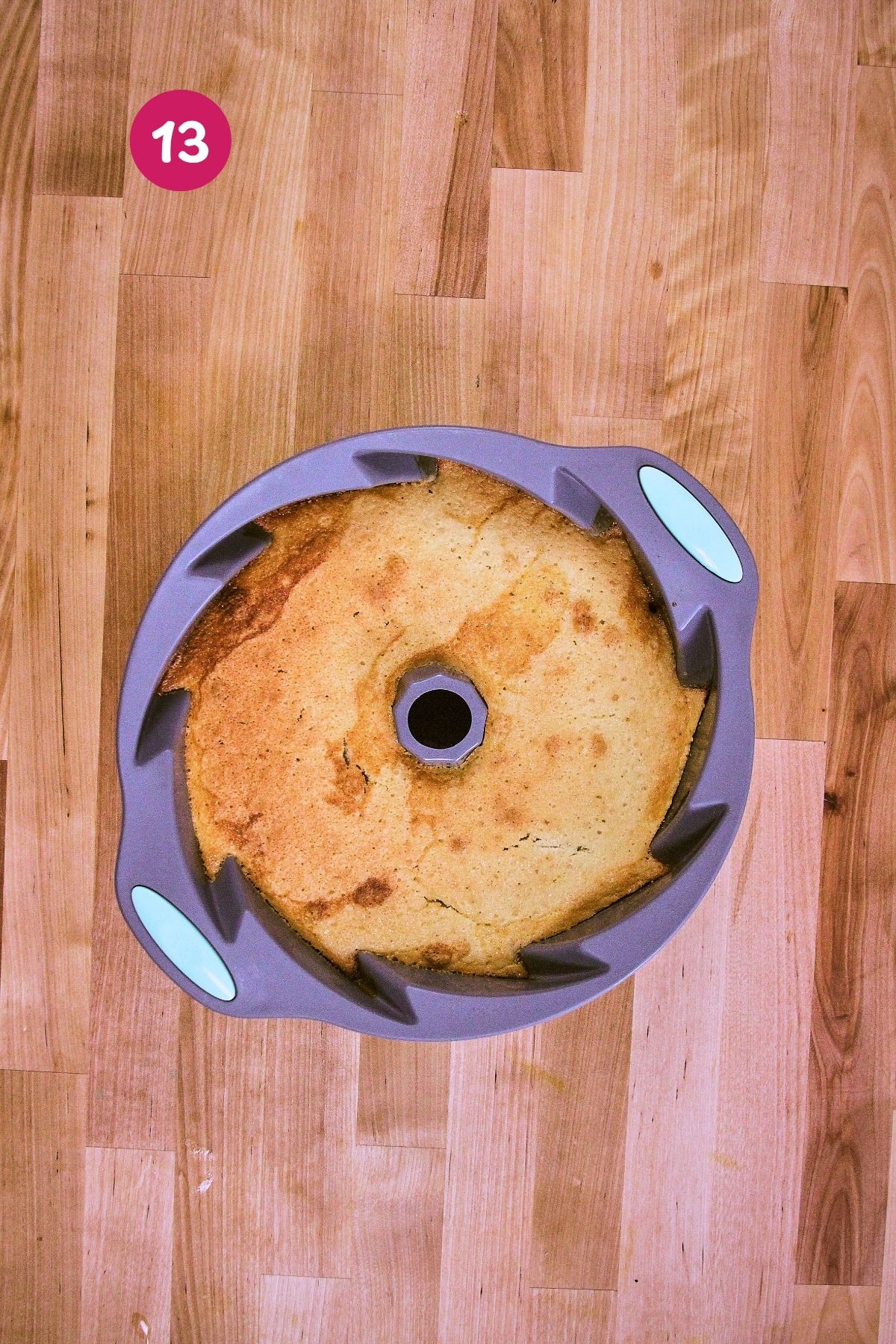Baked flancocho in a silicone bundt mold, showing the golden cake layer after coming out of the oven.