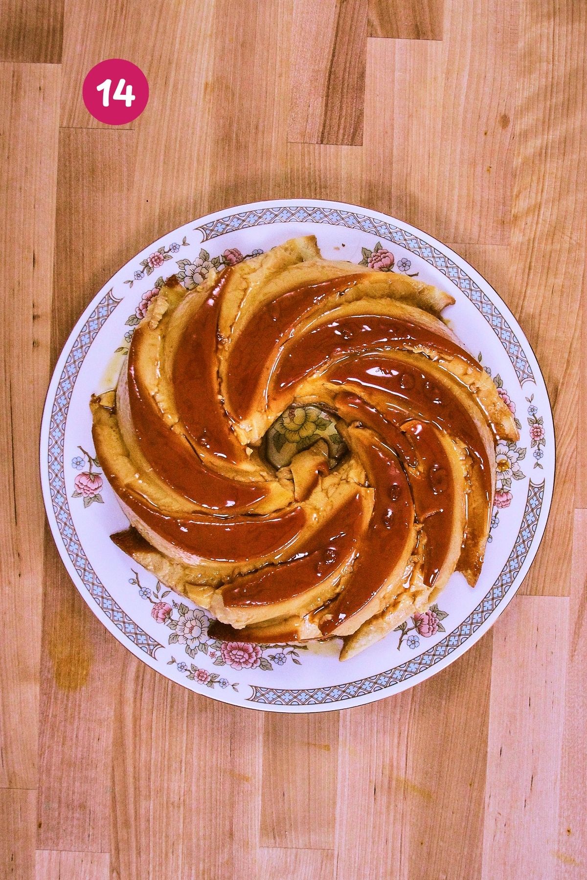 Flancocho unmolded onto a floral serving plate with caramel running down the sides of the silicone bundt mold pattern.